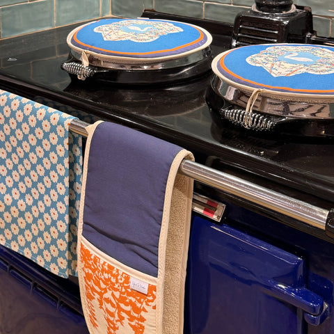 Hob Covers, Tea Towel And Oven Gloves displayed on AGA 